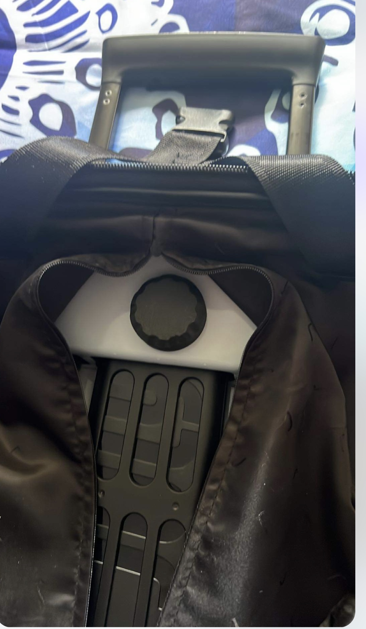 ToolTag installed inside the lining of a suitcase