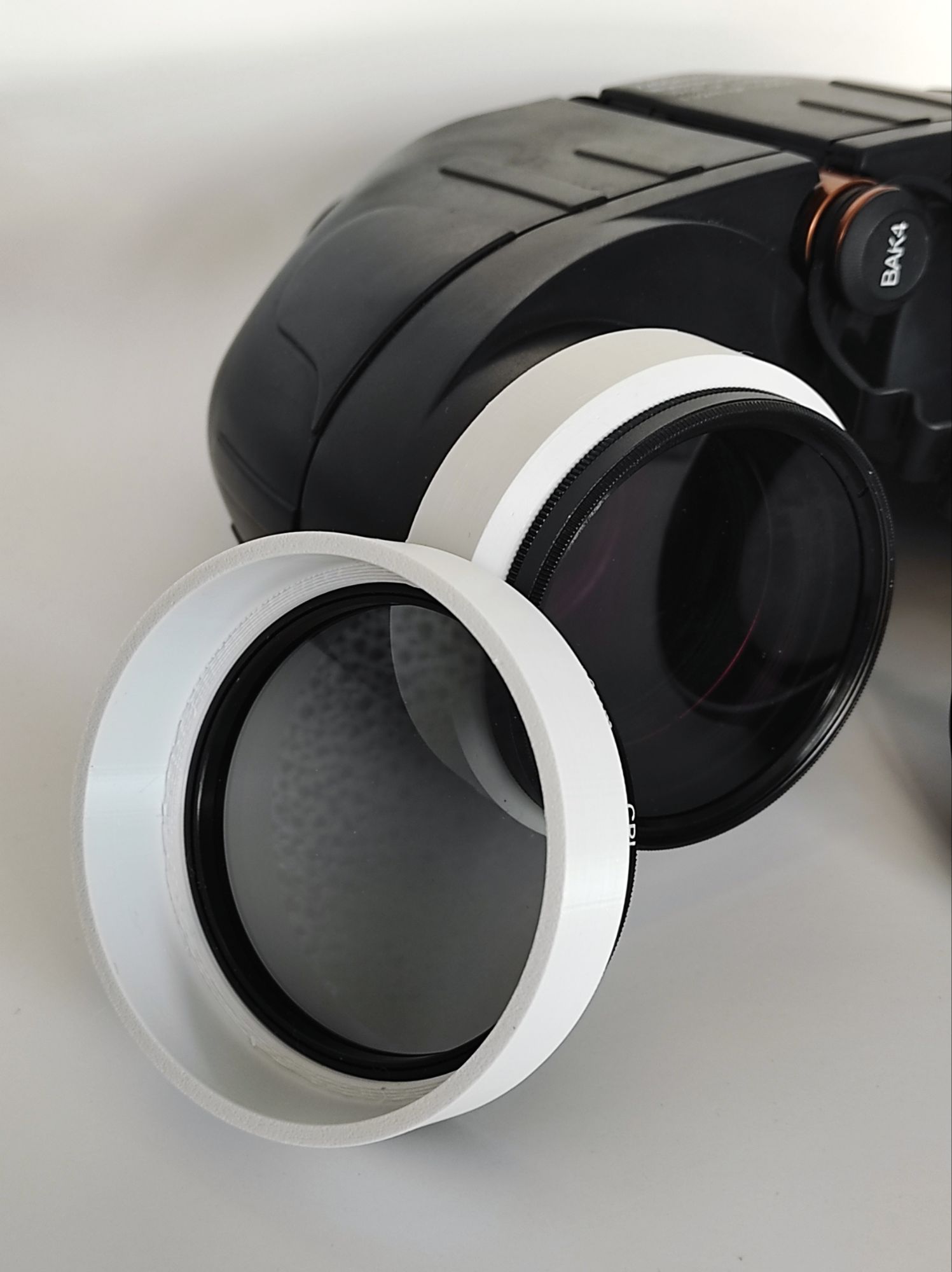Polarised lens caps for binoculars